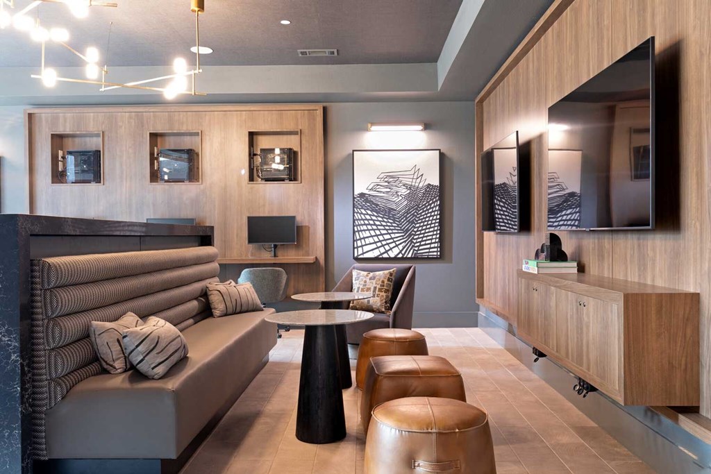 a living room filled with furniture and a flat screen tv