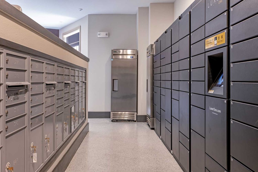 a large room with many lockers and a vending machine