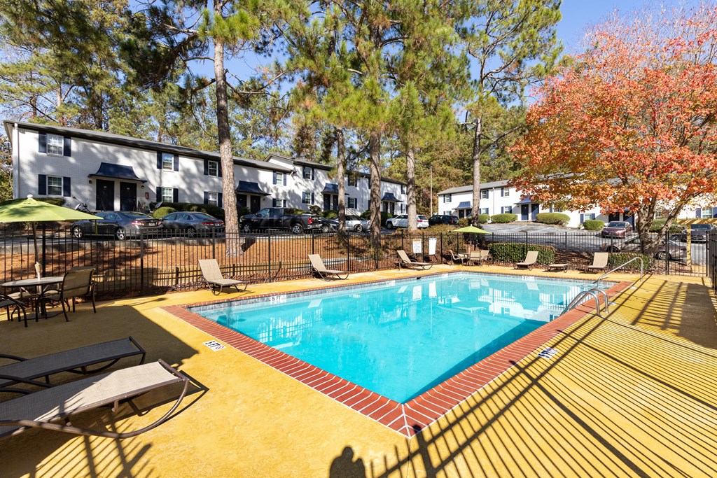 a resort style pool with chairs around it