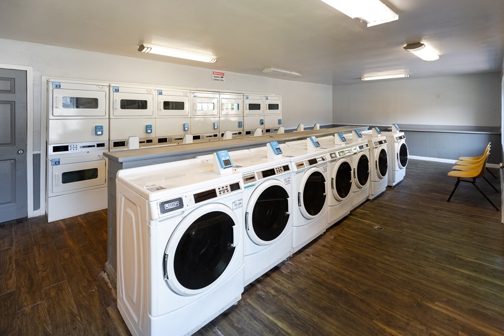 a row of washing machines in a public laundromat