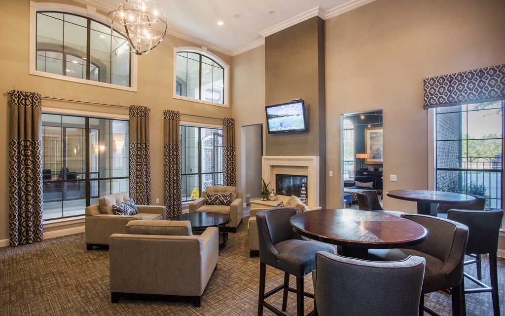 A living room with a fireplace and a television.