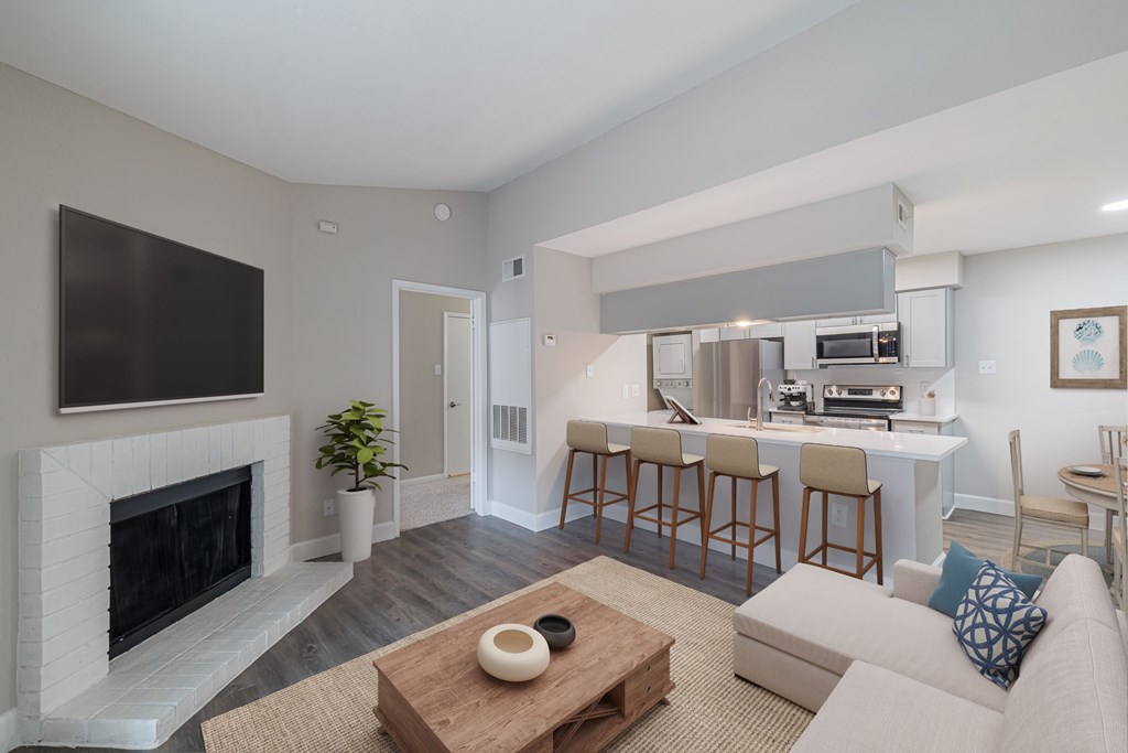 A living room with a fireplace and a couch.