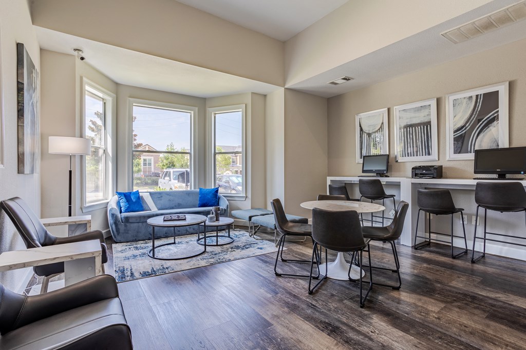a living room with a couch and a table and chairs