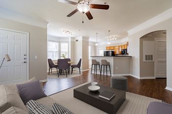 A living room with a grey couch and a coffee table.