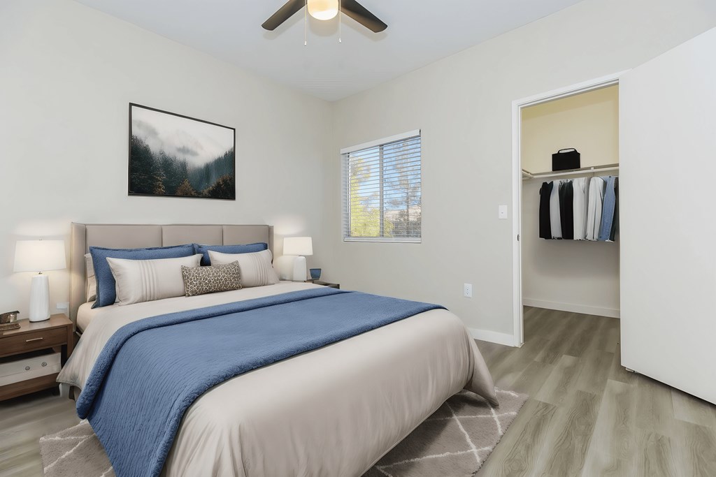 a bedroom with a bed and a closet