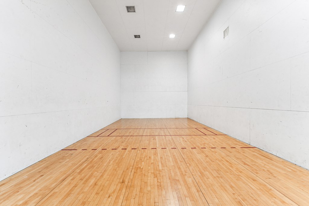 the indoor racquetball court is clean and ready to be used