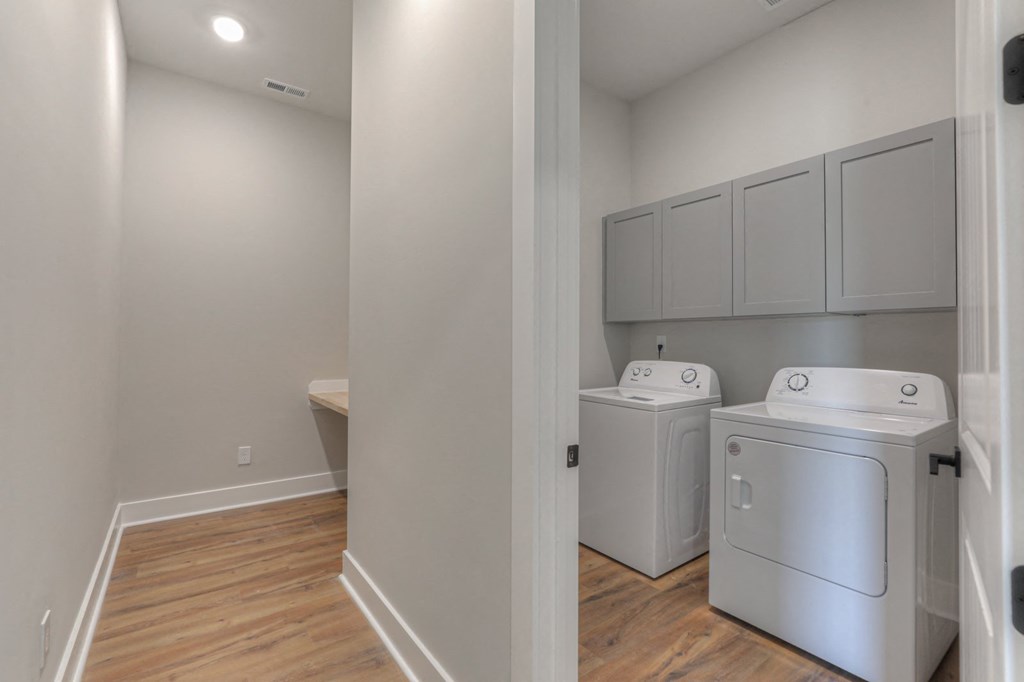 a room with a washer and dryer and a laundry room