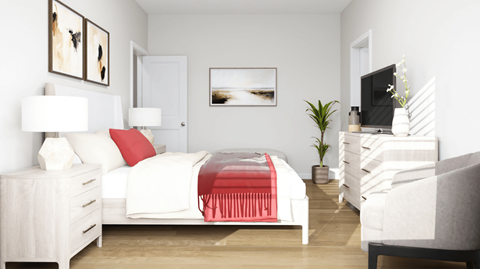 A white bedroom with a red blanket on the bed.
