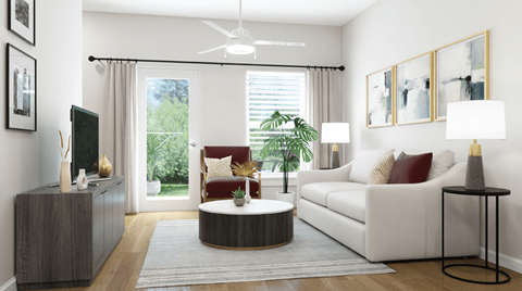 A living room with a white couch, a television, a coffee table, and a potted plant.