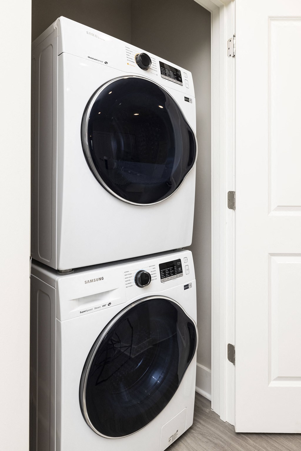 a white washer and dryer in a laundry room