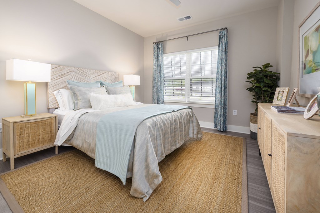 a bedroom with a large bed and a window