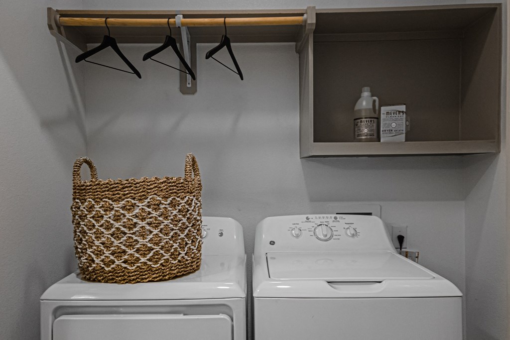 a laundry room with a washer and dryer
