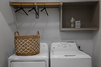 a laundry room with a washer and dryer - Photo Gallery 17