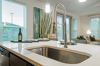a kitchen with a sink and a window - Photo Gallery 8