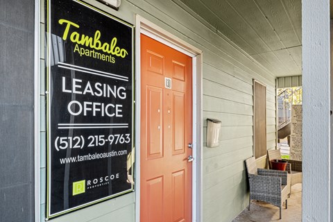 the front door of a building with a leasing office sign