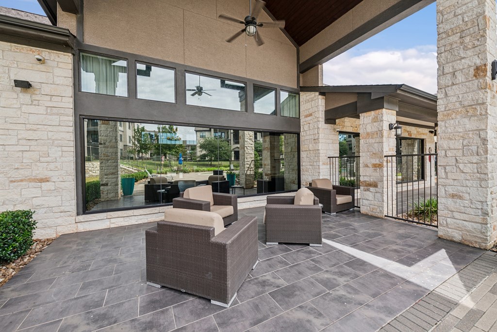 A patio with a table and chairs is shown.