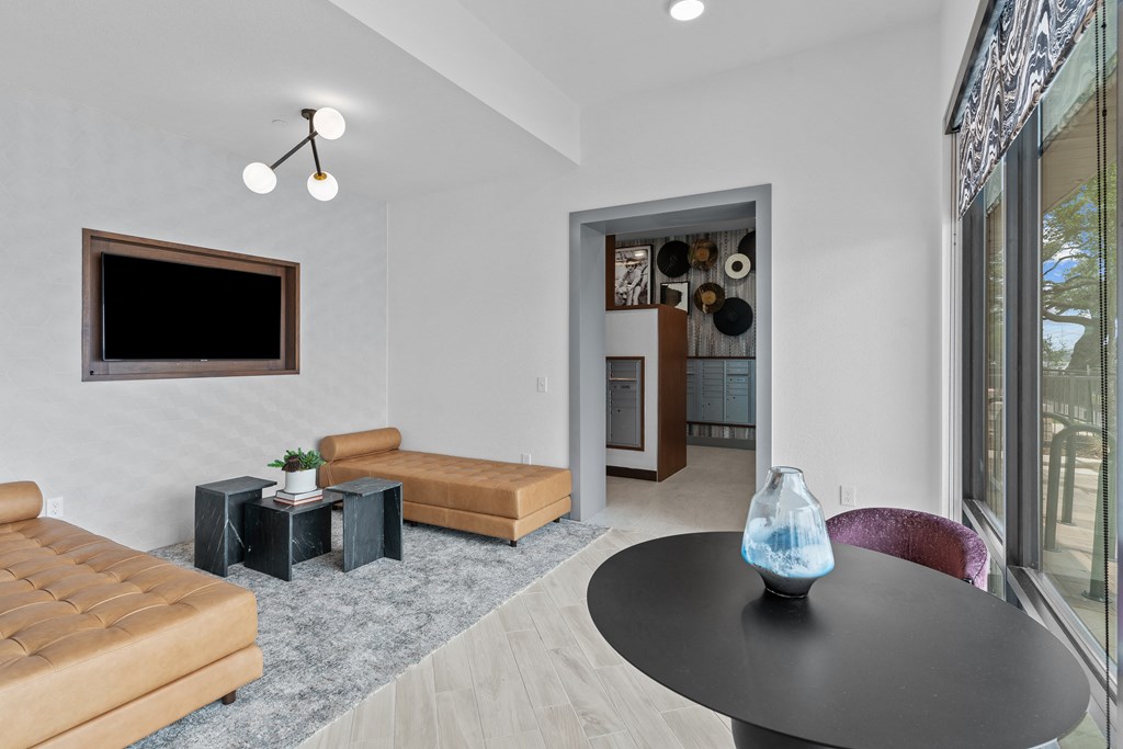 a living room with a couch and a table and a television