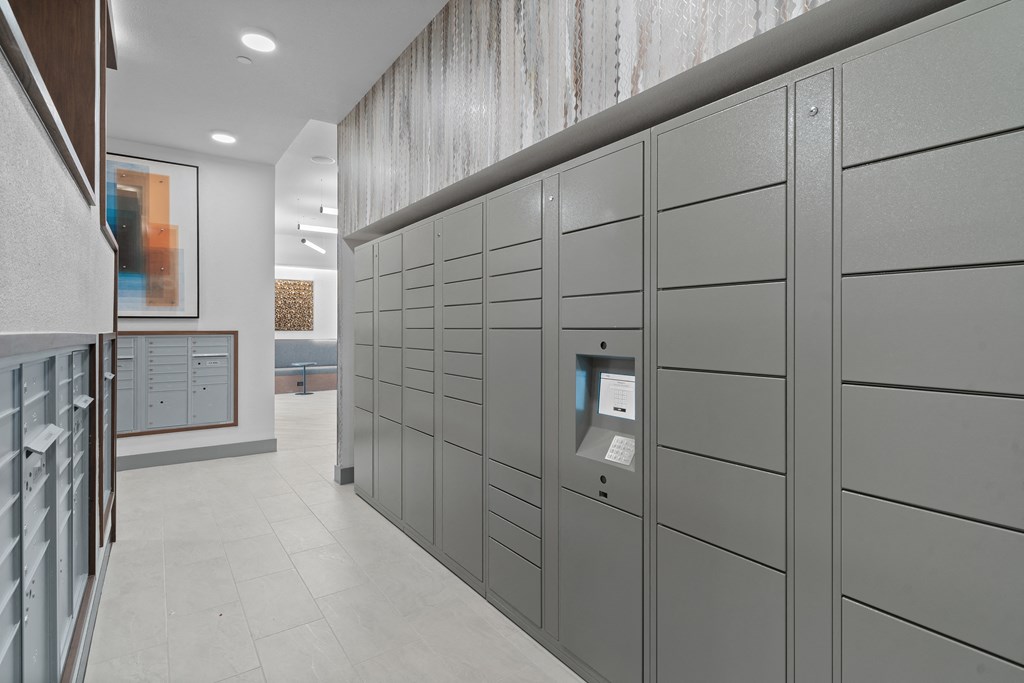 a row of lockers in a room with a white tile floor