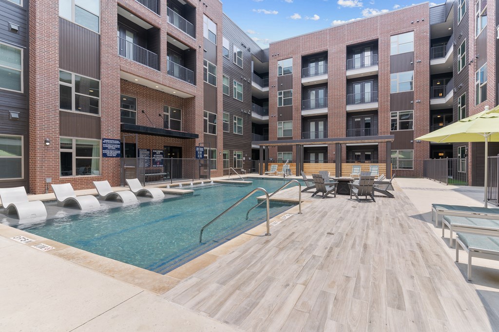 a swimming pool in the middle of an apartment building