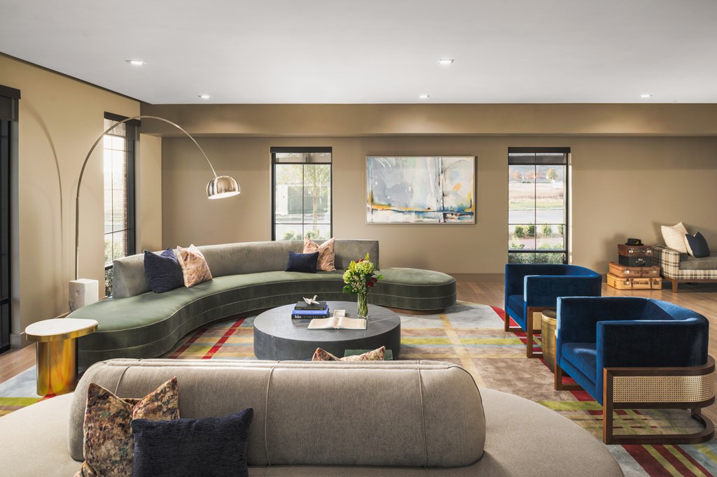 A living room with a grey sofa and a coffee table.
