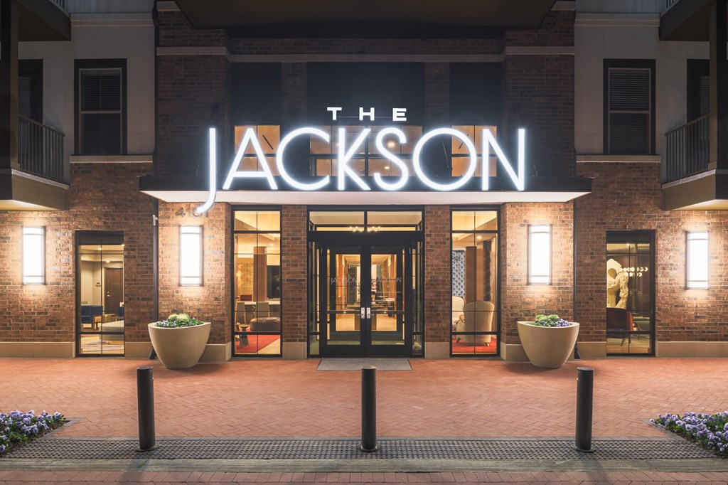 The Jackson hotel entrance is lit up at night.