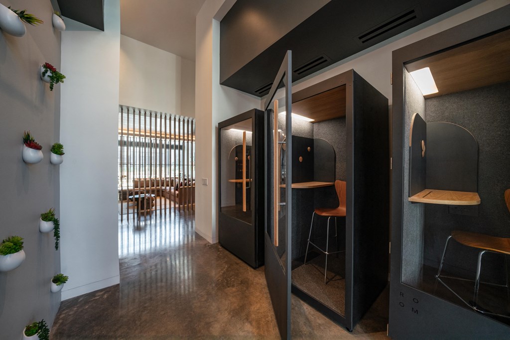 A modern interior with a black and wood design featuring a bar area.