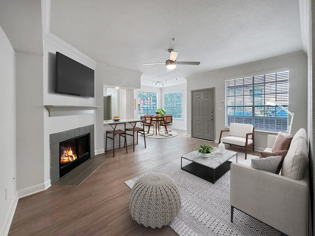 a living room with a fireplace and a television