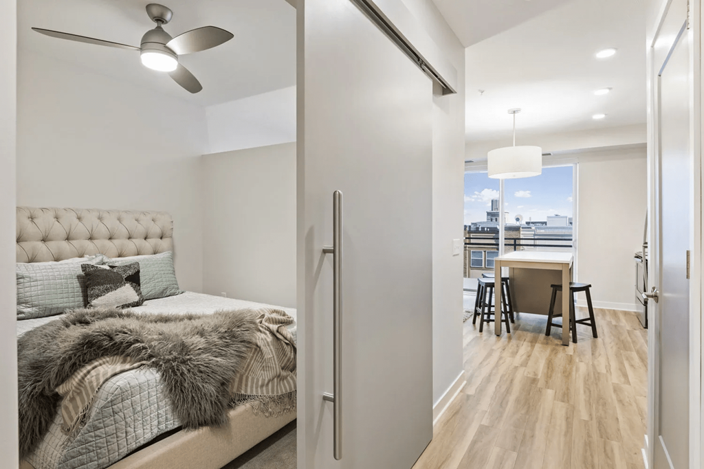 View of bedroom and hall to living area