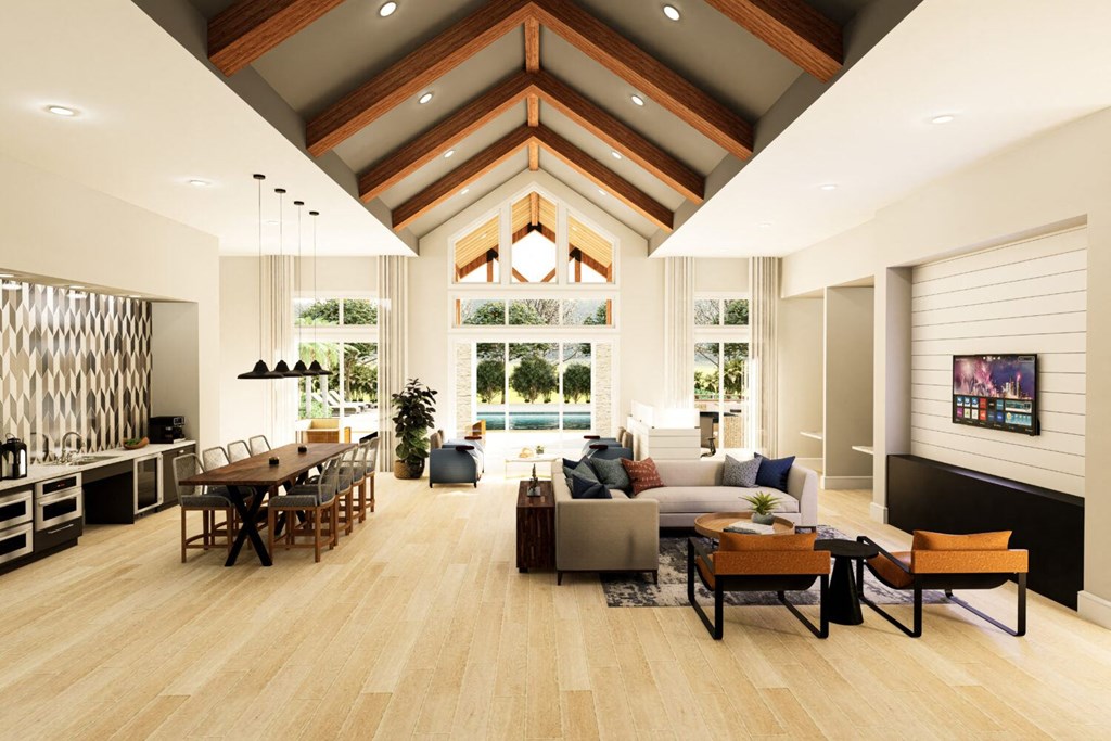 a living room and dining room in a modern house with high ceilings