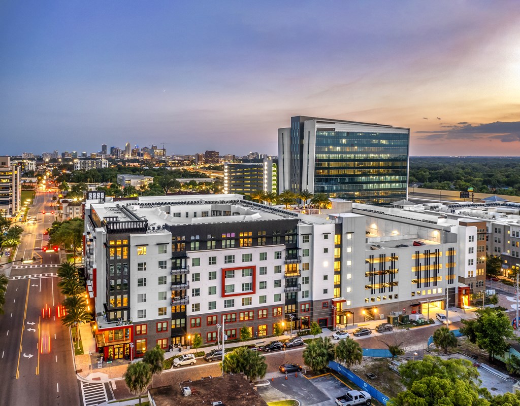an aerial view of an apartment complex in a city at night