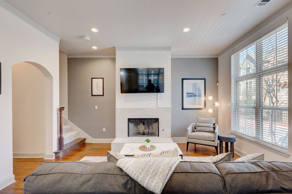 a living room with a couch and a fireplace