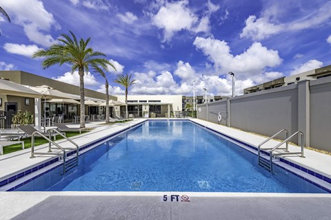 A large indoor swimming pool with a 5 FT depth marker.