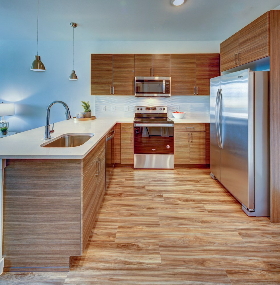 kitchen with a sink and silver appliances at Brixton South Shore, Austin, Texas