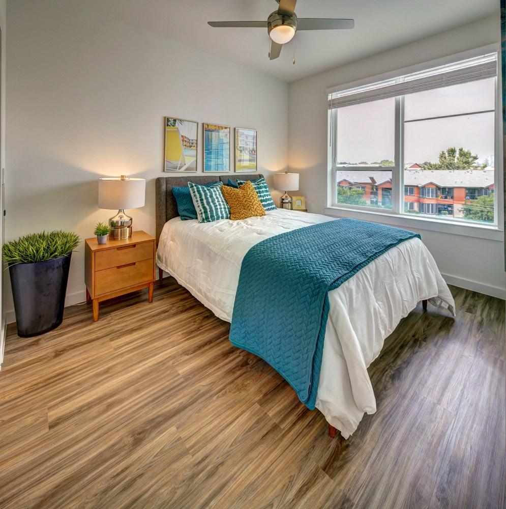 bedroom with green and white comforter at Brixton South Shore, Austin, 78741