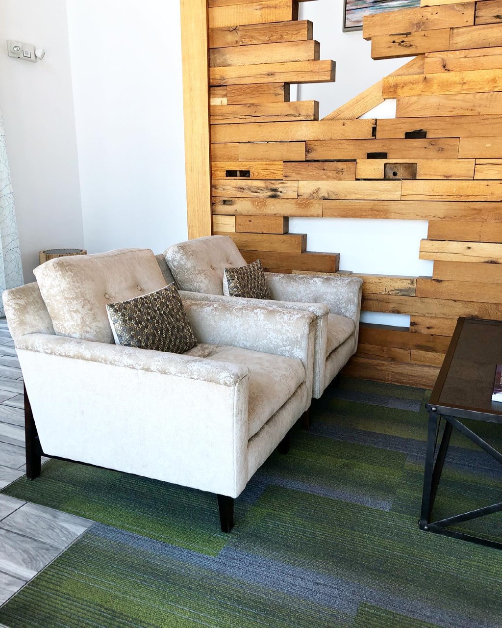 a living room with a couch and stairs in the background