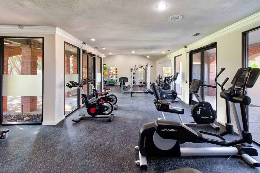 A spacious gym with a variety of exercise equipment.