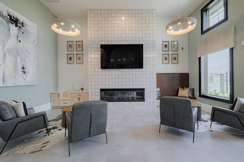 a living room with a fireplace and a tv