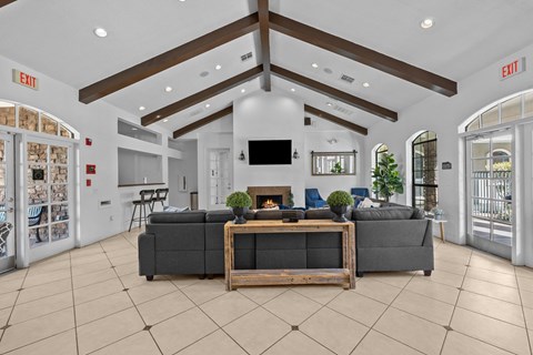 the living room of a house with couches and a fireplace
