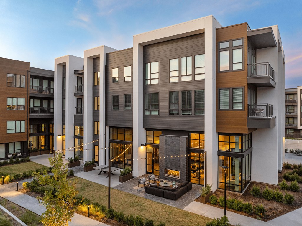 A modern building with a mix of wood and white exterior.