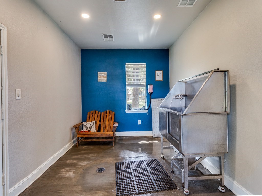 A room with blue walls and a wooden chair.