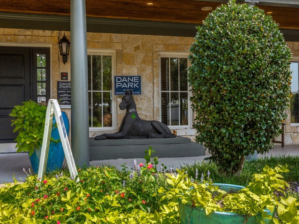 A sign that says Dane Park is on the front of a house.