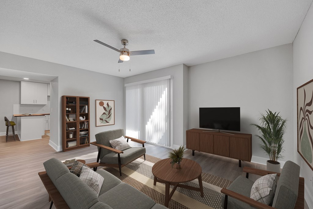 a living room with a couch and a table and a tv