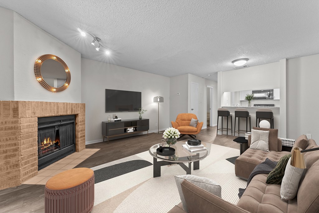 A modern living room with a fireplace and a television.