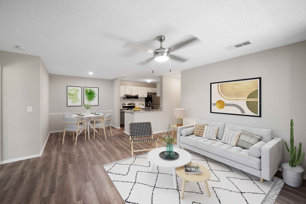 our apartments offer a living room with a couch a coffee table and a dining table