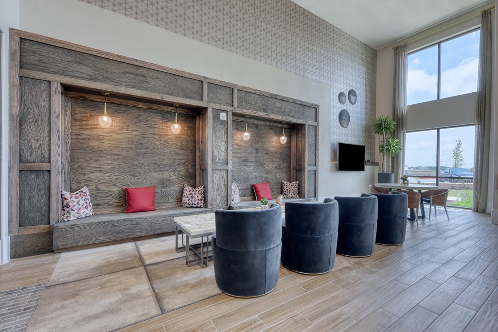 a living room with a couch and a table with chairs