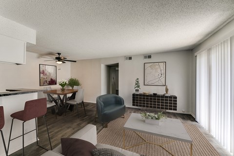 an open living room and dining room with a table and chairs