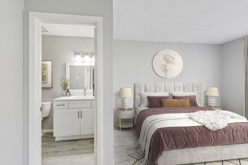 a bedroom with a bed and a bathroom