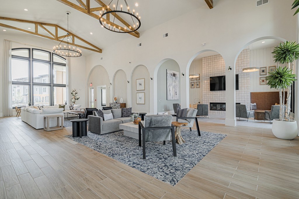 a living room filled with furniture and a large window