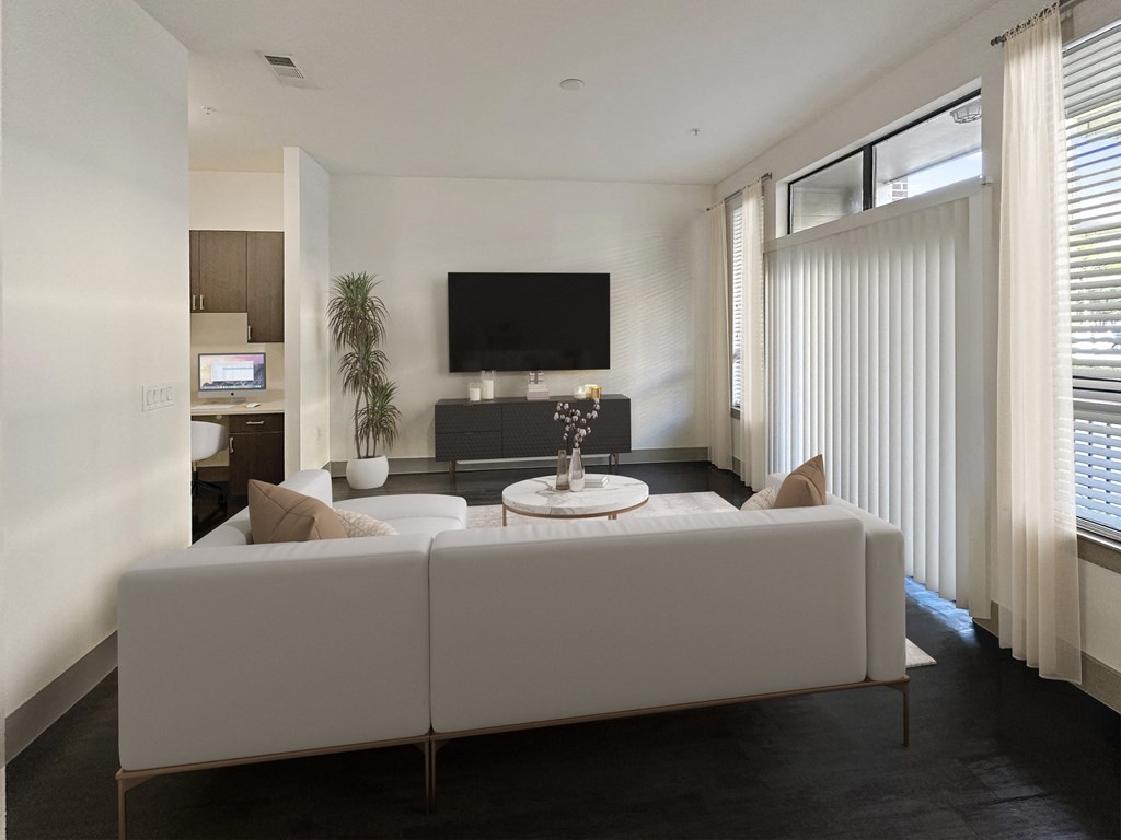a white living room with a white couch and a table