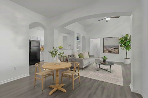 A modern living room with a wooden table and chairs.